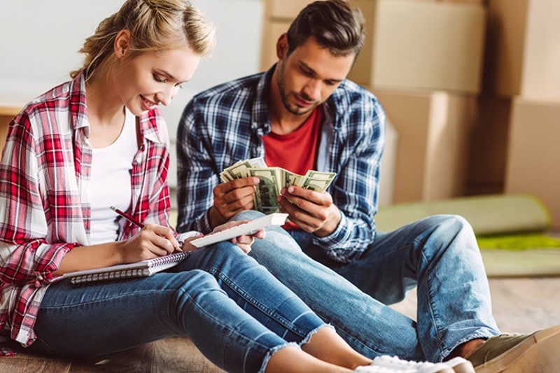 Understanding Your Air Conditioner. Man and women sitting on floor.